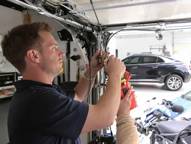 Hollywood Garage Door Repair safety certified technician performing cable replacement in Hollywood