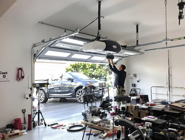 Hollywood Garage Door Repair specialist installing smart garage door opener system in Hollywood home